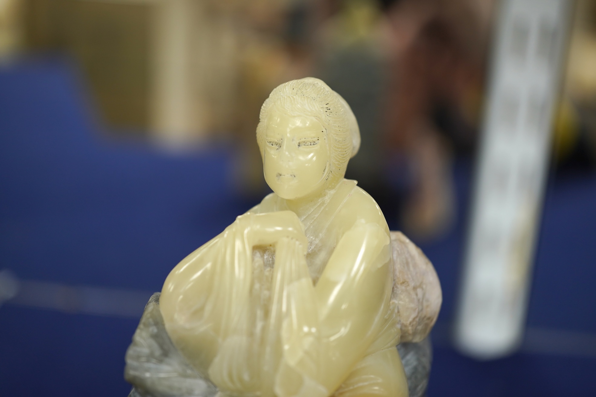 Three Chinese Shoushan stone figures of ladies and an associated stand, tallest 14cm